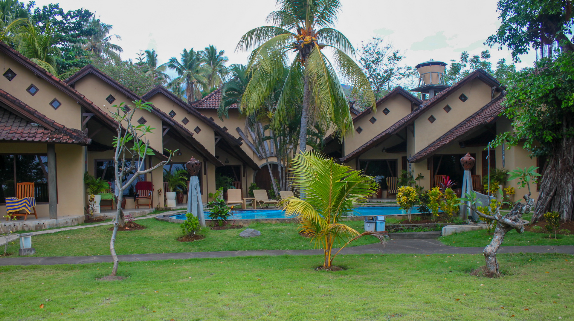 Poolside Bungalows with ceiling fan in Hotel Uyah Amed Bali