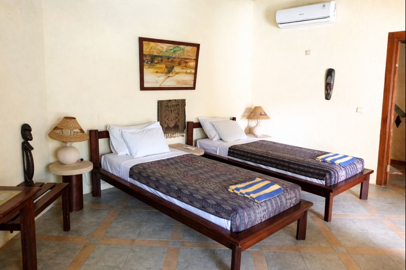 Poolside Bungalows with ceiling fan in Hotel Uyah Amed Bali